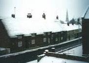 thumbnail of snow-covered rooftops in an English village